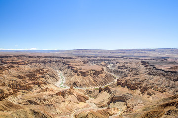 Fototapeta na wymiar Beautiful wide angle view of Fish River Canyon in the Canyon Nature Park near Hobas in Namibia, Africa. 