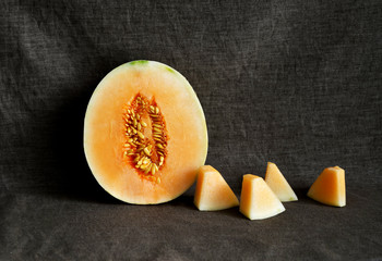 Cantaloupe Melon on clothing background, fruit healthy food, space for 