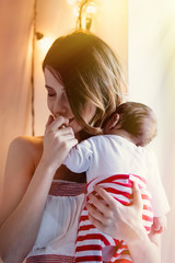 Redhead mother with new born child.