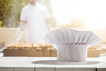 cook chef hat and white desk space 