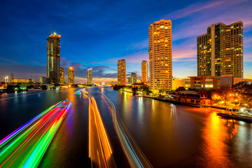 Fototapeta na wymiar Light trails of traffic on the Chao Phraya river, Bangkok. Thailand. view from Taksin bridge Bangkok