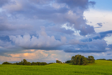 Sunset over rural landscape in Masurian Lakeland region of Poland