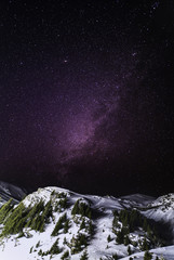 Sky night with stars in the mountains during the winter