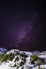 Sky night with stars in the mountains during the winter