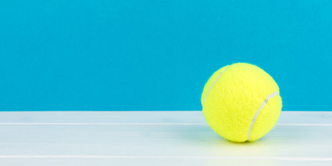 tennis ball with blue background panorama
