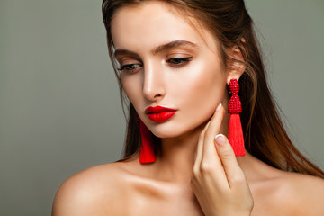 Perfect Young Model Woman with Makeup and Red Beads Earrings. Young and Beautiful