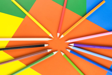 Fototapeta premium Colorful pencils on the paper background.
