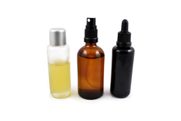 Cosmetic bottle stock images. Brown cosmetic bottle with batcher. Vials on a white background. Glass bottle of oil