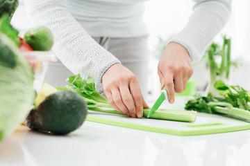 Woman chopping celery