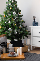  A cozy corner, gifts under the Christmas tree, decorations for Christmas, Christmas spruce. New Year.