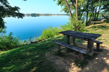 Obraz premium Camping pitch on summer lake calm beach