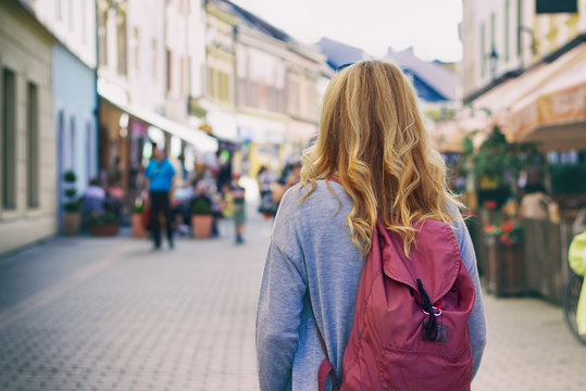 Woman Tourist Is Walking In The Street In The Historic European City 