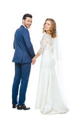 Naklejka premium back view of beautiful wedding couple holding hands isolated on white