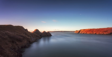 Three Cliffs Bay and the Great Tor
Full tide and early Winter sun lighting up Three Cliffs Bay and the Great Tor on the Gower peninsula in Swansea, South Wales, UK