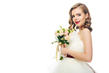 side view of bride in wedding dress with bouquet of flowers in hands isolated on white