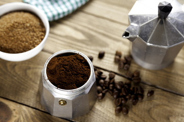 Italian coffee maker with napkin and brown sugar