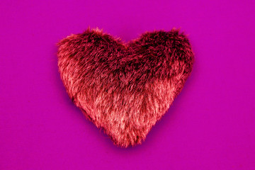 Red heart on pink background