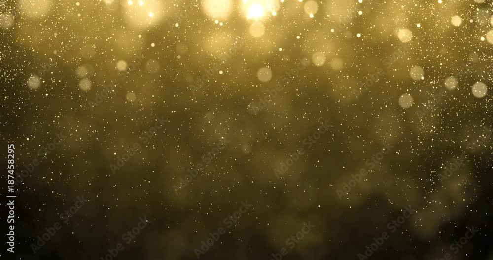 Poster abstract gold particles of golden glitter fallling down with bright bokeh shine effect. shimmering a
