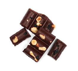 Chocolate bars with blueberries, almonds and hazelnuts isolated on white background, top view