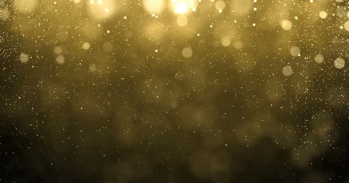 Abstract gold particles of golden glitter fallling down with bright bokeh shine effect. Shimmering and glittering golden light glow glare for luxury premium awarding or Christmas background design