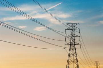 High voltage post.High-voltage tower sky with sun