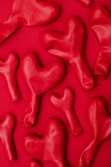 Red heart shaped balloon on a red background