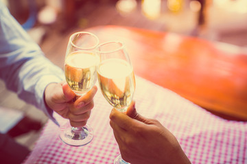 Christmas and Happy new year anniversary party holiday with smash toast sparkler wine in beautiful champagne glasses and christmas tree as background