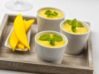 Three bowls of mango mousse