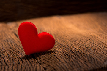 Fototapeta premium red heart shape on wood background