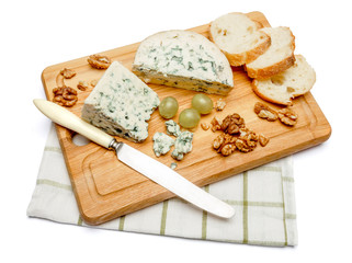 blue cheese on wooden cutting board