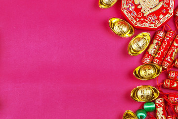 Chinese new year festival decorations, ang pow or red packet and gold ingots. Chinese characters...