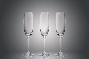 three empty clean glasses on grey