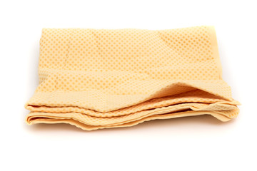yellow chamois (microfiber towel) for cleaning concept on white background
