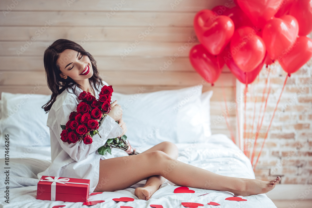 Wall mural young woman at home