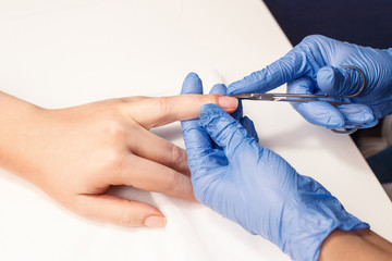 cutting cuticule in beauty salon