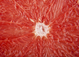 texture of a cut of a greyfruit as a background
