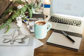 Home Office Deck with Graphic Tablet, Laptop, Drawing and Coffee Cup. Workplace Background