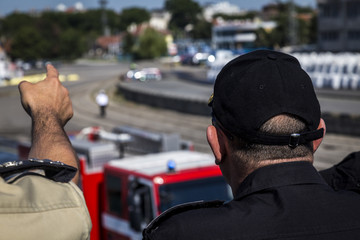 Chief shows the commander how it goes and what happens with the military training. Chiefs and Commanders monitor training.