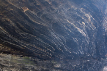 Rock texture. Texture of a mountain wall. Relief of the mountain.