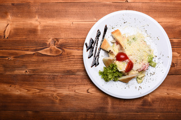 Salad made of chicken, vegetables and croutons