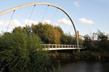 metal pedestrian footbridge crossing the river aire in leeds