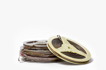 Old scratched reel music tape isolated on white background