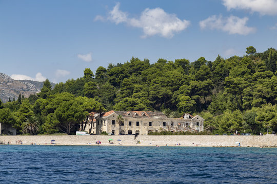 Kupari beach with a hotel destroyed by the war in Kupari, Croatia.