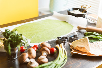 Chef cook step by step makes green ravioli in the shape of a heart for a festive dinner