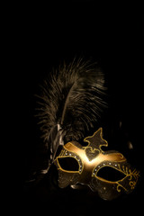 gold mask on black background