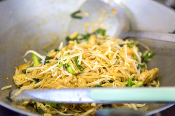 Popular Thai recipe, Pad Thai with Crispy wonton and chicken ,bean sprouts topped halved lemon, Thai Popular Street Food