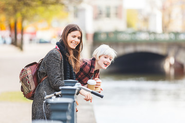 Two women having fun at canalside in Berlin © william87