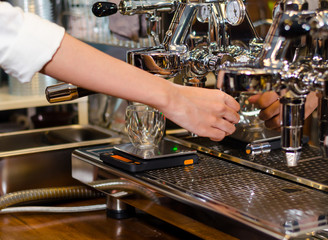 The Barista preparing espresso with machine at coffee shop. start up small business owner food and drink concept