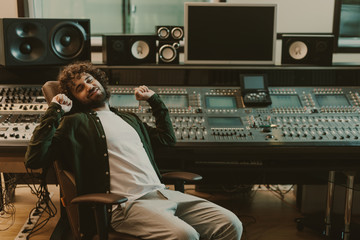 Naklejka na ściany i meble happy tired sound producer stretching in studio