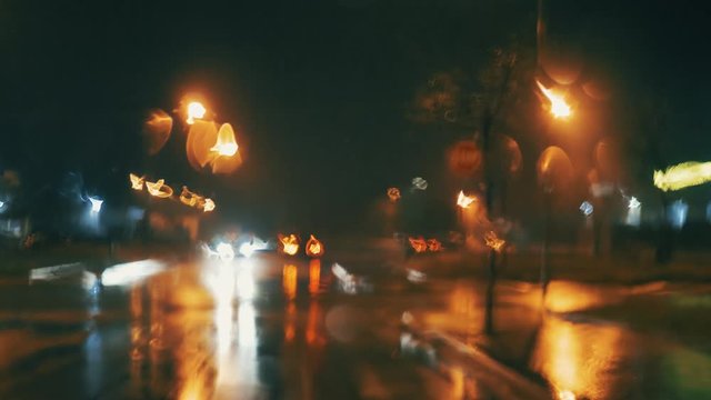 urban street traffic on the rainy night